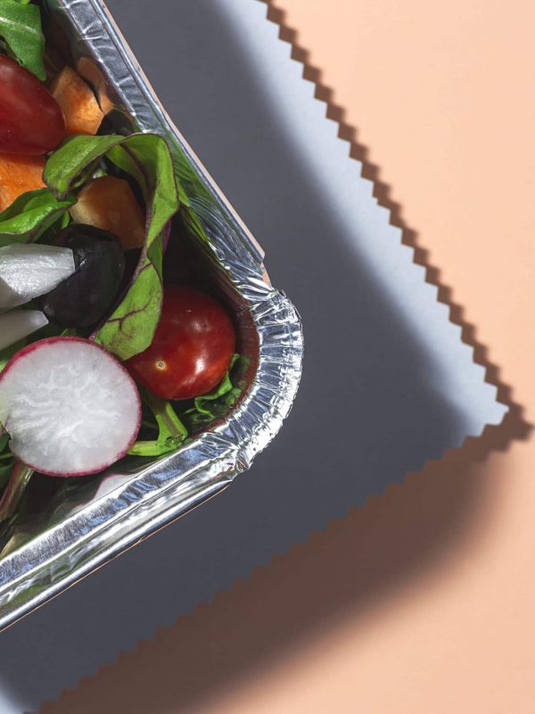 Healthy vegan Take away salad in aluminum container or food delivery. From above